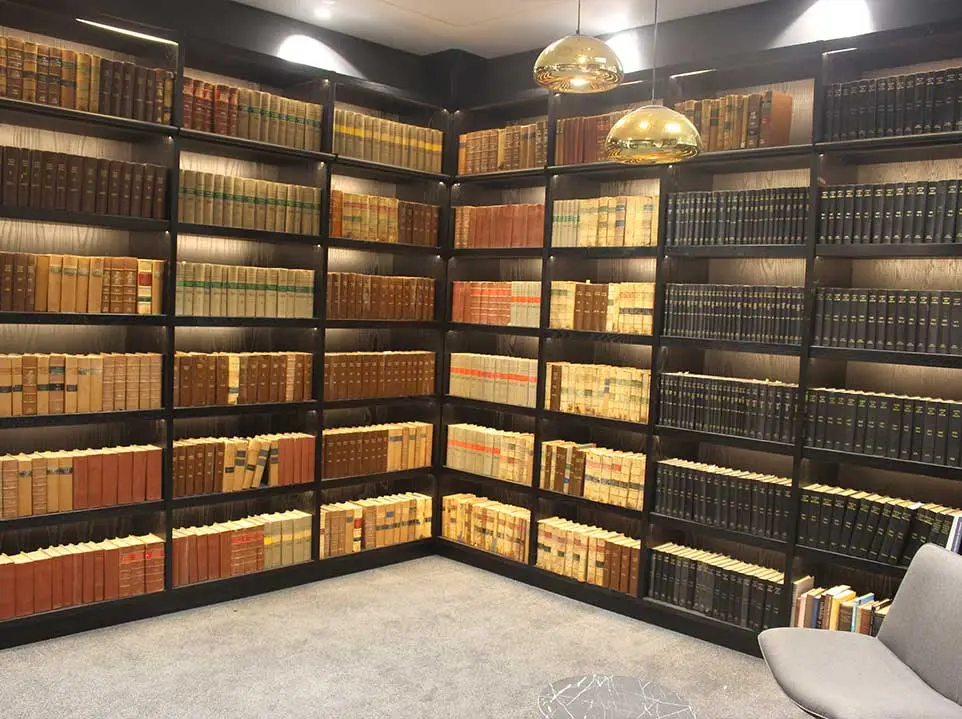 Illuminated shelving and seating at Huguenot Chambers Library