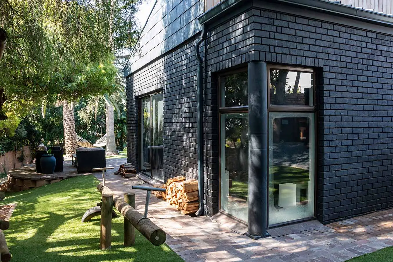 Corner glazing and charcoal brickwork at the Aurora residence